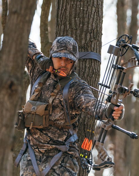 Kinetic Merino 350 Hoodie showing the hood in the field in ryse